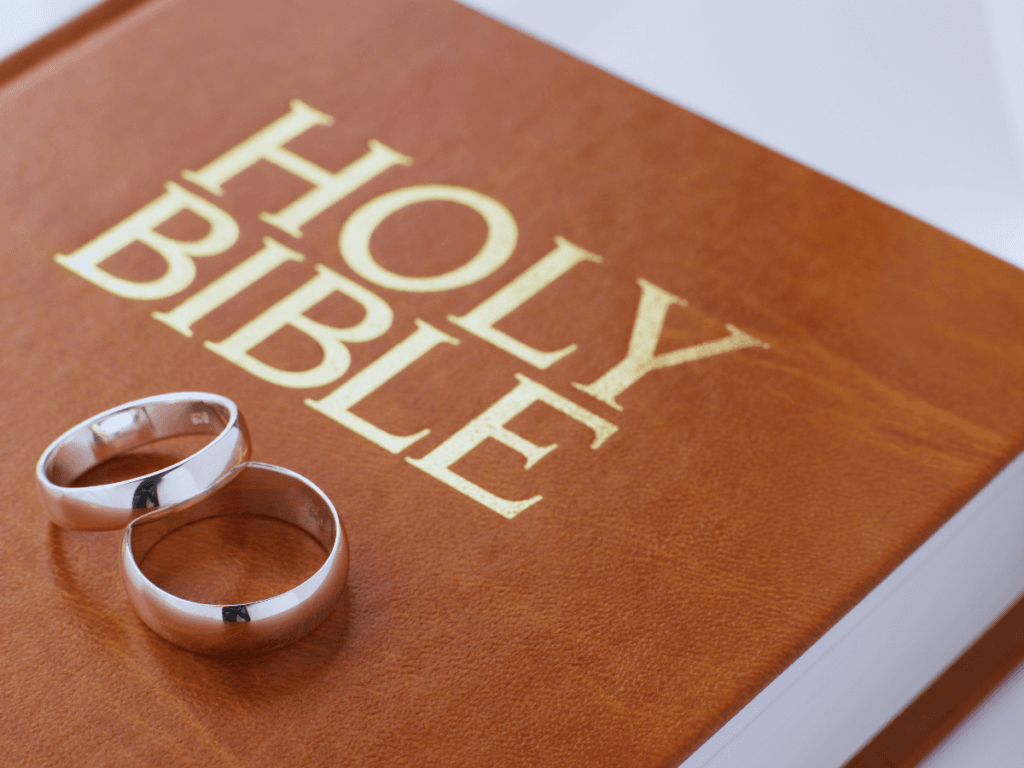 open Bible and two wedding rings representing a God-centered Christian marriage