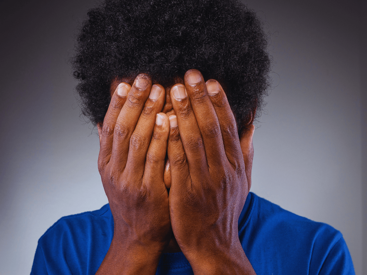 person praying in anguish asking why do bad things happen during a season of suffering